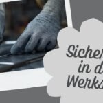 Hands in gray cut-resistant safety gloves handling sharp sheet metal in an industrial workshop