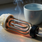 An electric immersion water heater coil on a countertop with a wisp of smoke, illustrating a fire hazard