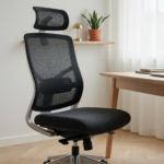 A modern ergonomic mesh office chair in a bright home office, illustrating the Branch chair recall over detaching backrests