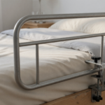 An adult portable safety bed rail attached to the side of a bed in a home bedroom